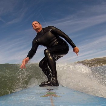 Flat Stanley stylishly works his way up to the nose of the board in order to hang ten