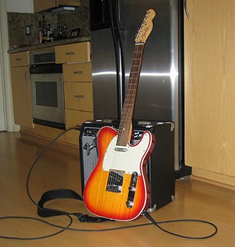 Telecaster guitar in kitchen